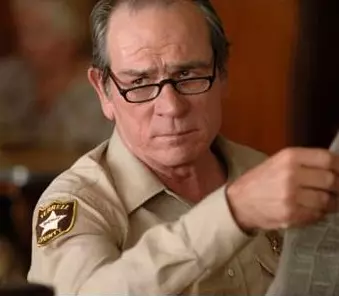 tommy lee jones with a newspaper meme image