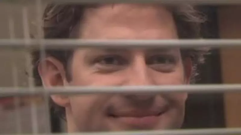 jim halpert smiling through blinds meme image