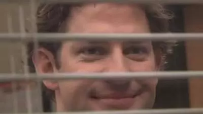 jim halpert smiling through blinds