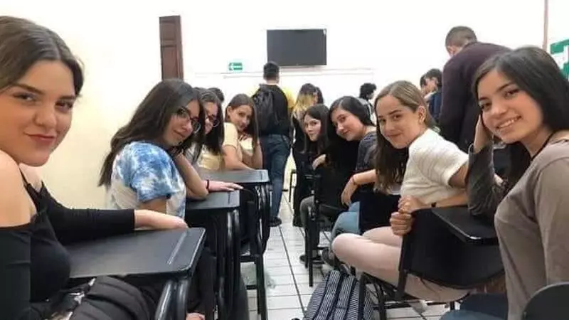 girls in class looking back meme image