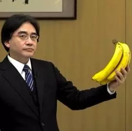 satoru iwata holding bananas meme image