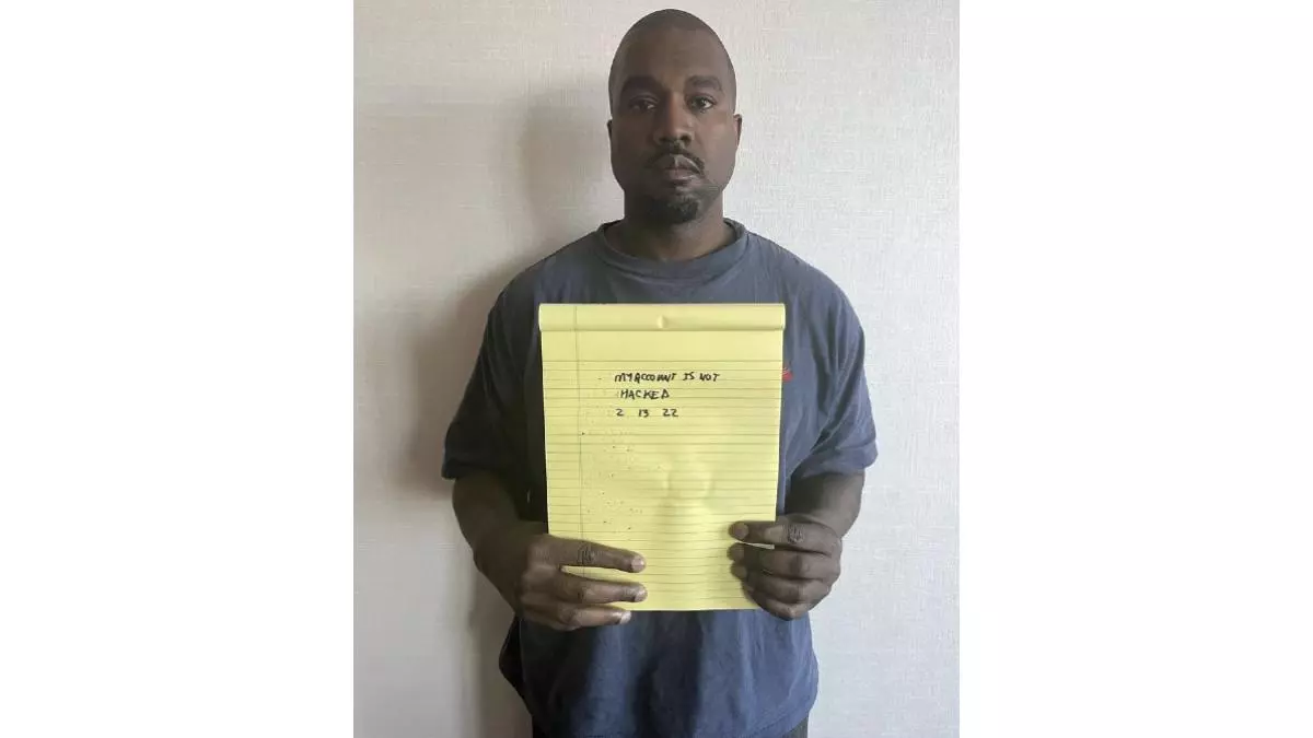 kanye west holding notepad meme image