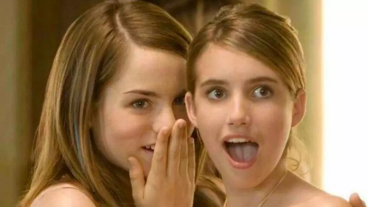 jojo whispering to surprised emma roberts meme image