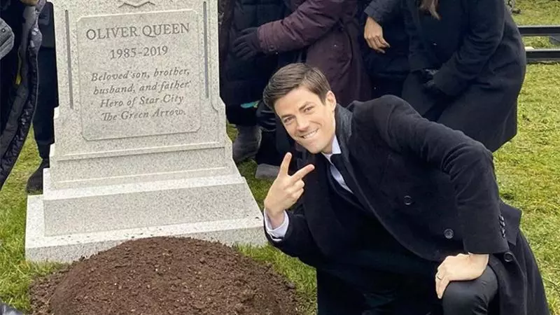 grant gustin next to oliver queens grave meme image