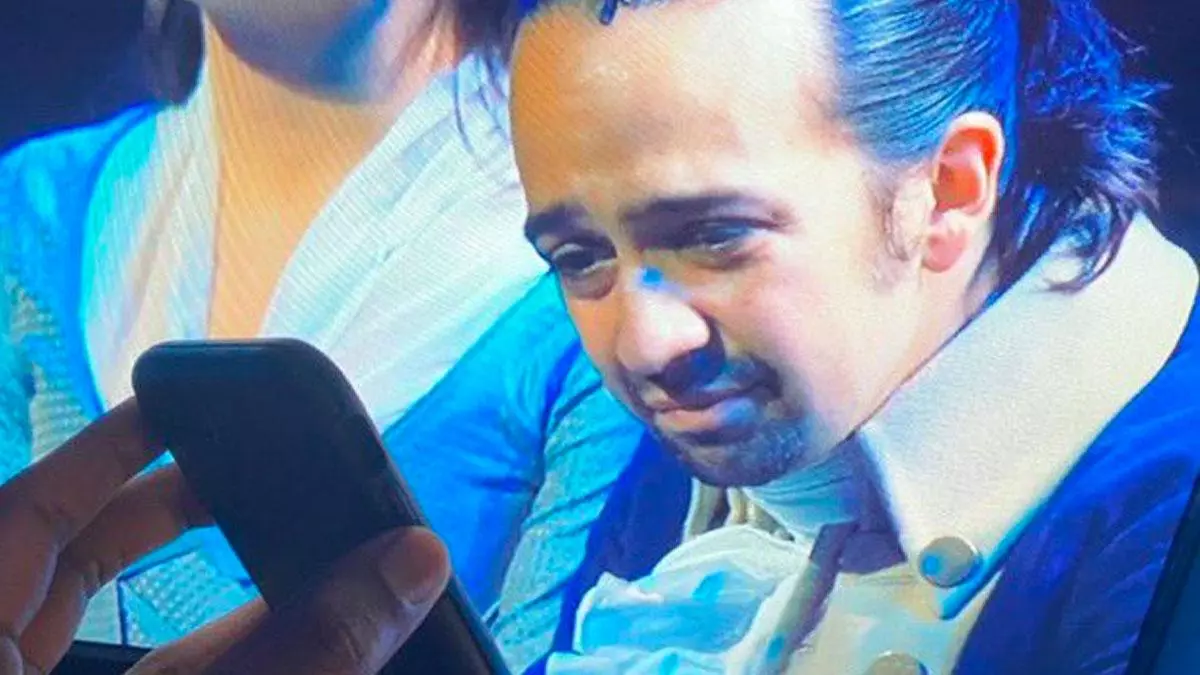 lin manuel miranda on tv reading off a smartphone meme image